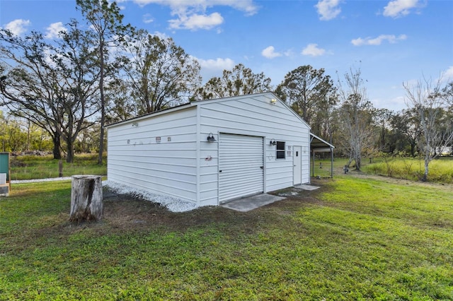 garage featuring a lawn