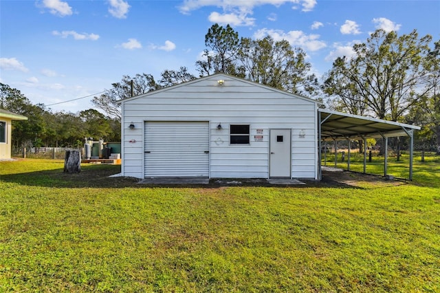 garage with a carport and a lawn