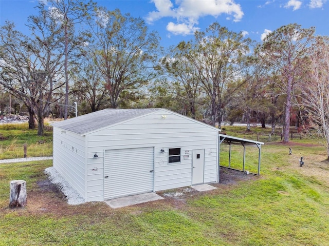 garage featuring a carport and a yard