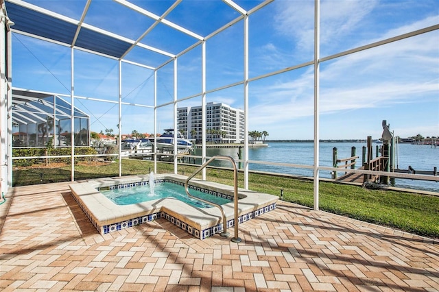 view of pool with glass enclosure, a water view, an in ground hot tub, and a dock