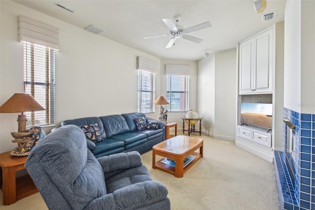 living room with ceiling fan and light carpet