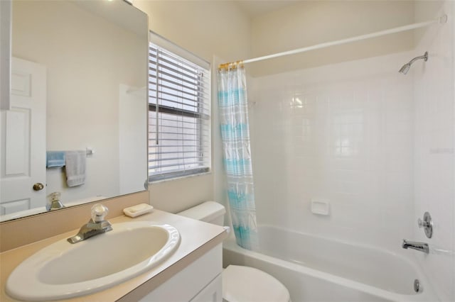 full bathroom featuring toilet, vanity, and shower / tub combo with curtain