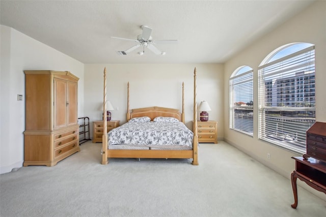 bedroom with light carpet and ceiling fan