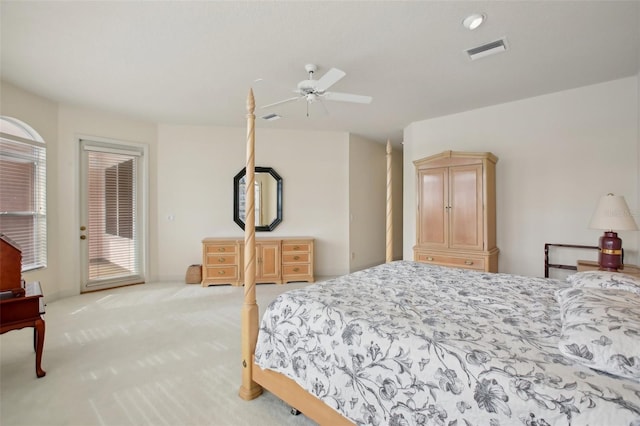 bedroom with light carpet, multiple windows, access to outside, and ceiling fan