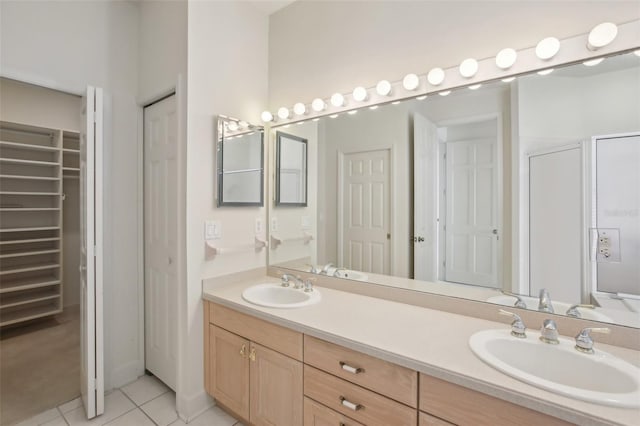 bathroom featuring tile patterned flooring and vanity