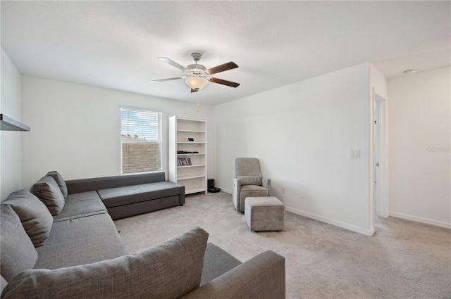 living room featuring ceiling fan and light colored carpet