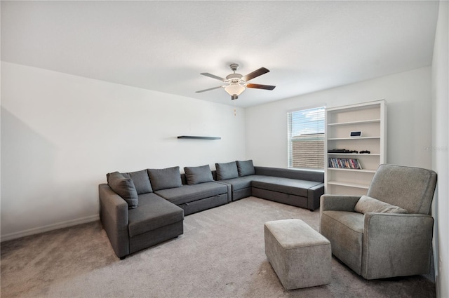 living room featuring ceiling fan and light carpet