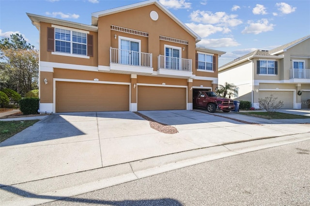 view of front facade with a balcony and a garage