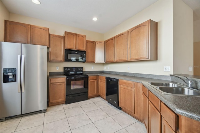 kitchen with sink, light tile patterned floors, and black appliances