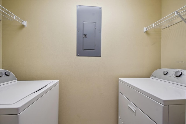 laundry room with independent washer and dryer and electric panel