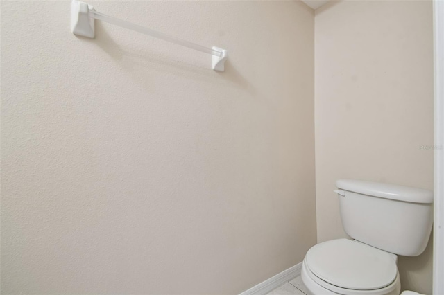 bathroom with tile patterned floors and toilet