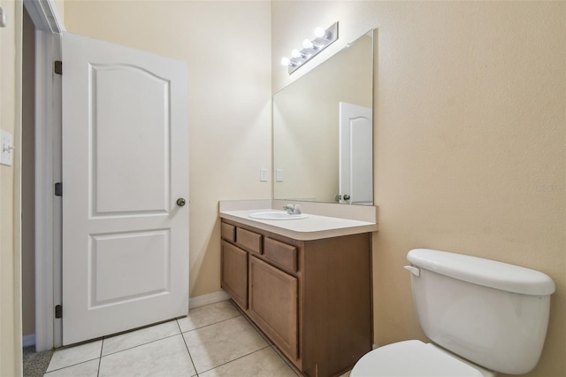 bathroom with tile patterned floors, vanity, and toilet