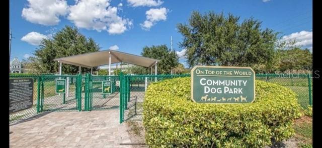 surrounding community with a gate and fence