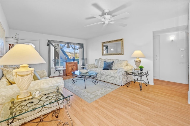 living area featuring ceiling fan and wood finished floors