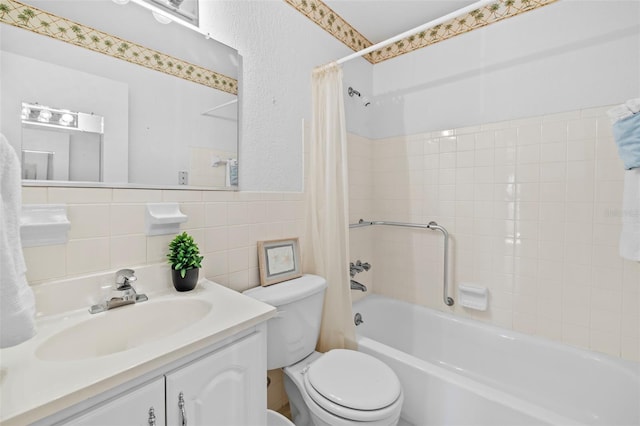 full bath featuring shower / bathtub combination with curtain, tile walls, toilet, and vanity