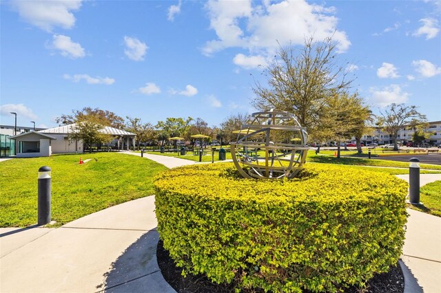 view of property's community with a yard