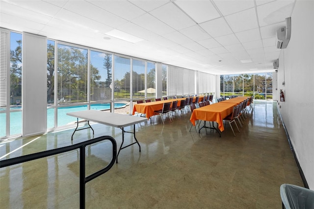 sunroom featuring a paneled ceiling