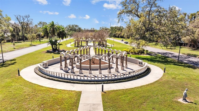 view of property's community featuring a yard