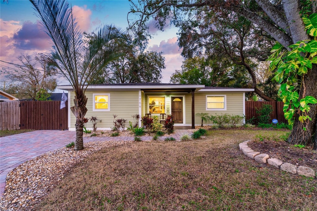 ranch-style home with covered porch