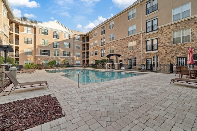 pool with a patio area