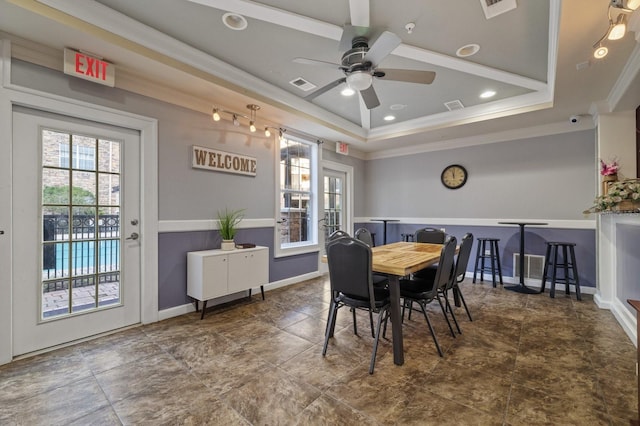 dining space featuring baseboards, a raised ceiling, a ceiling fan, ornamental molding, and recessed lighting