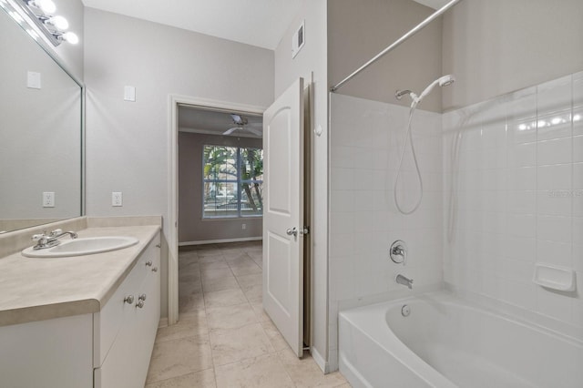 full bath featuring baseboards, visible vents, tile patterned floors, vanity, and washtub / shower combination