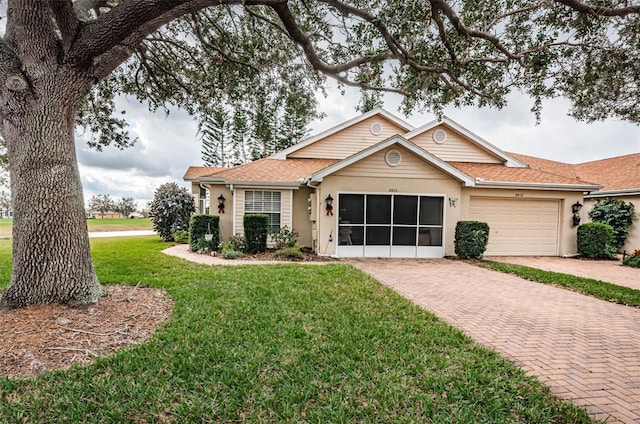 ranch-style home with a front yard and a garage