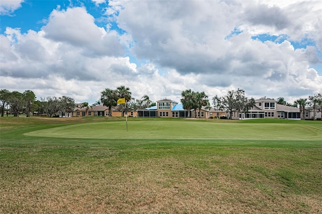 view of property's community with a yard