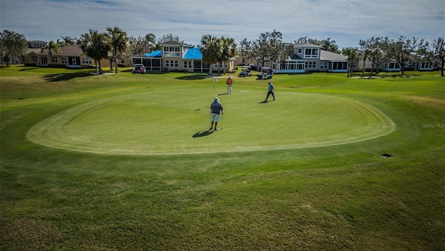 view of property's community featuring a lawn