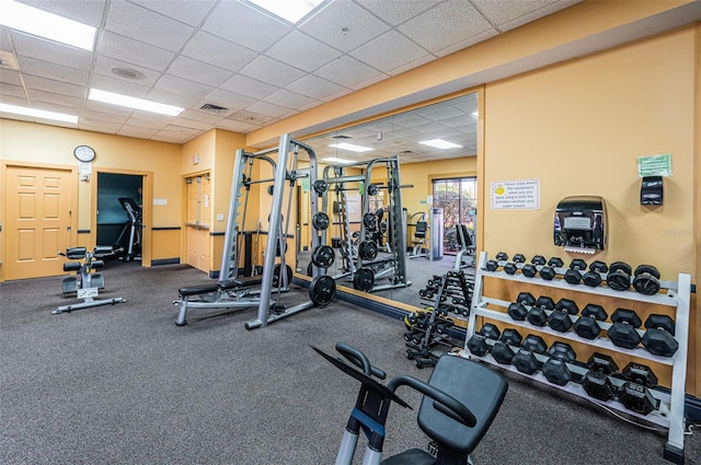 workout area with a drop ceiling