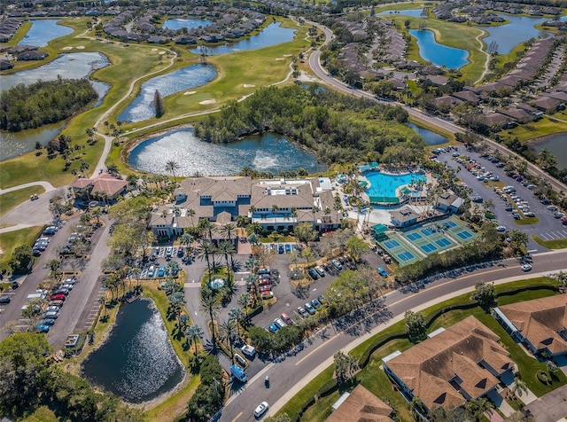 birds eye view of property with a water view