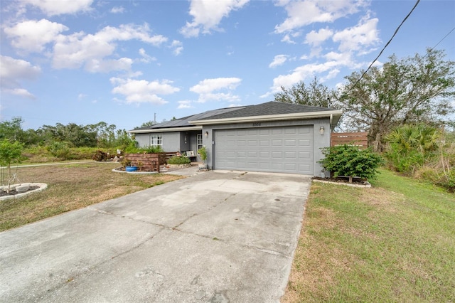 single story home featuring a front yard and a garage