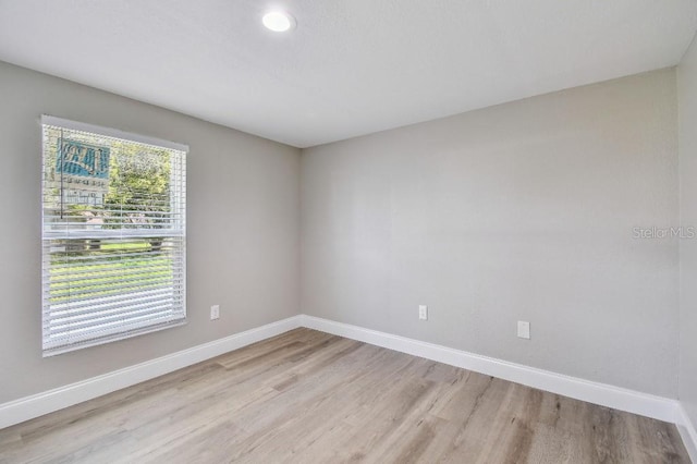 empty room with light hardwood / wood-style floors