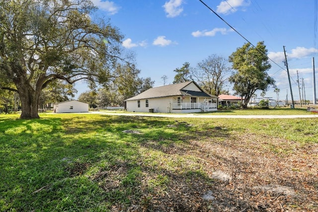 view of yard with covered porch