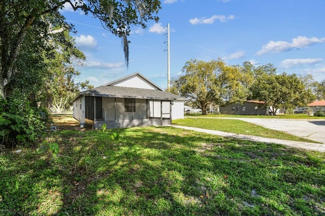 view of yard featuring a sunroom