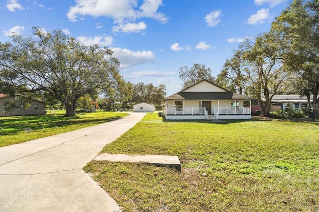 view of front of home with a porch and a front yard