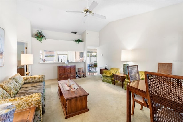 living room with light colored carpet, ceiling fan, and lofted ceiling