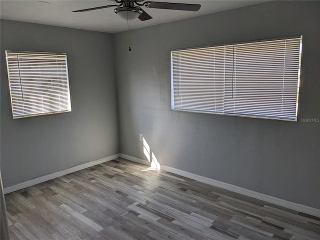 spare room with light hardwood / wood-style flooring and ceiling fan