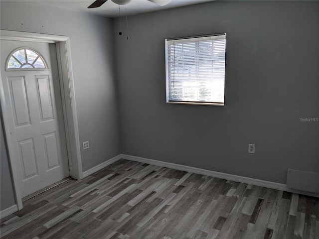 foyer entrance featuring hardwood / wood-style floors and ceiling fan