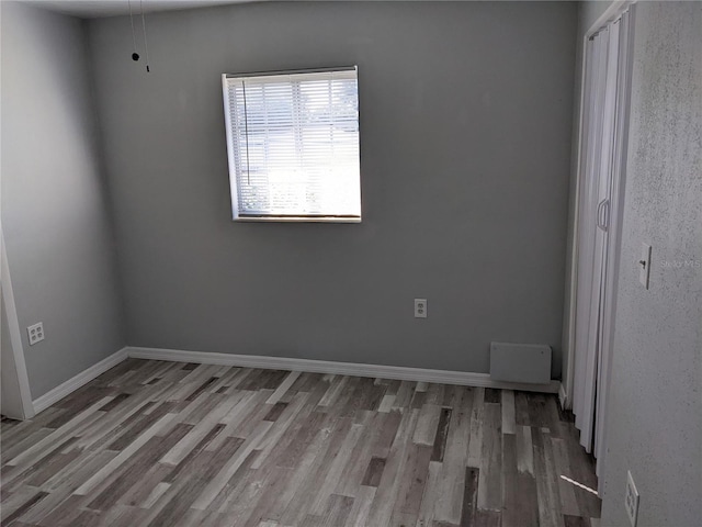 unfurnished bedroom featuring wood-type flooring