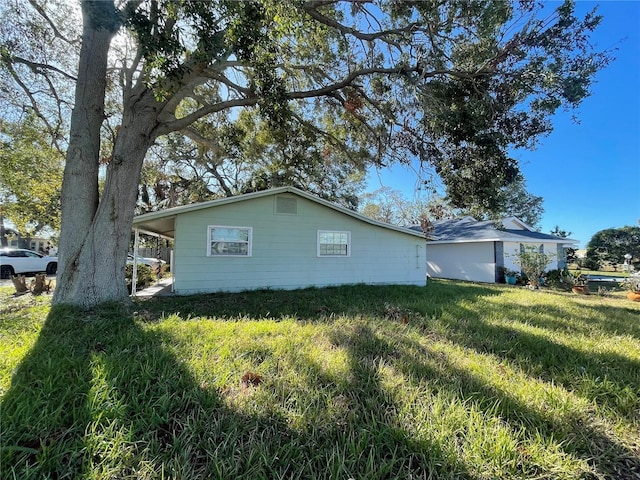 view of property exterior featuring a yard