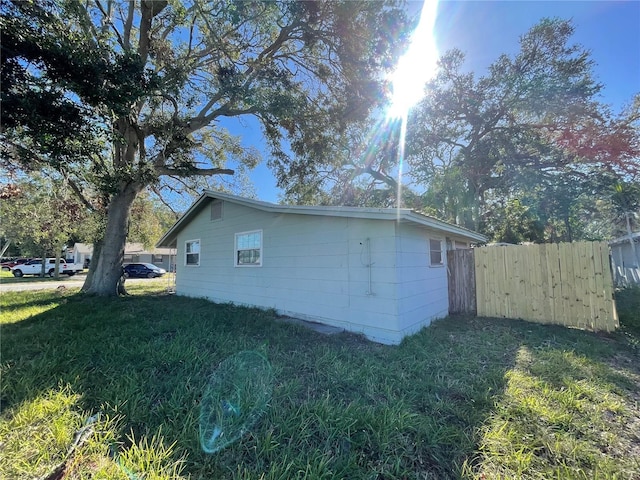 view of property exterior featuring a yard