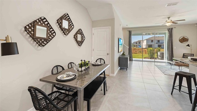 tiled dining room with ceiling fan