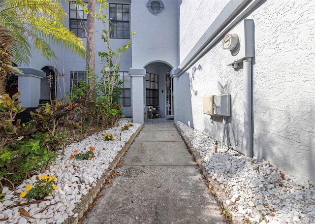 property entrance with stucco siding