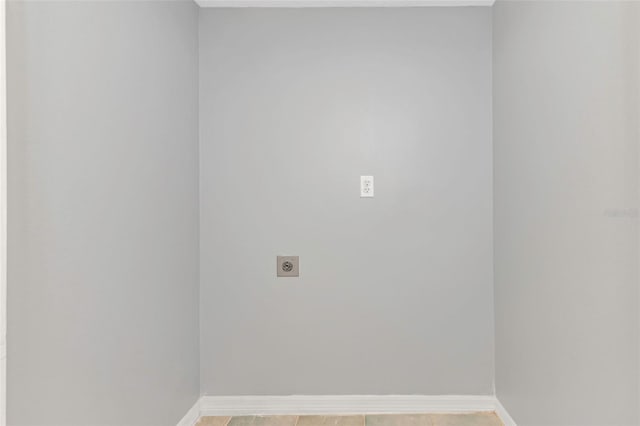 laundry area featuring laundry area, baseboards, and electric dryer hookup