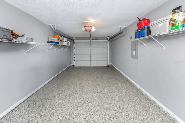 garage with baseboards, electric panel, and a garage door opener