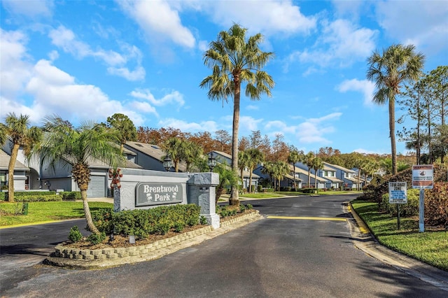 view of street with a gated entry and a residential view