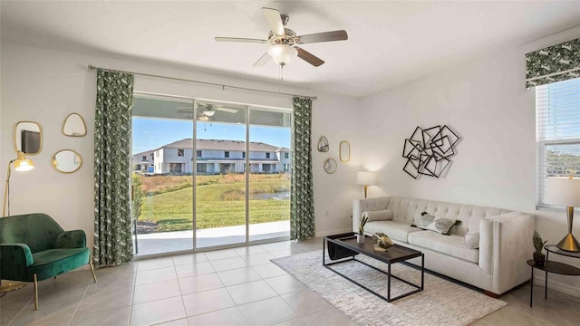 living room with plenty of natural light and light tile patterned floors