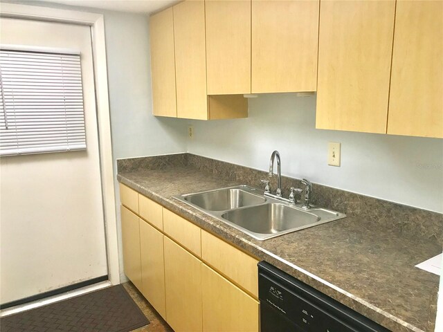 kitchen with black dishwasher, sink, and light brown cabinets