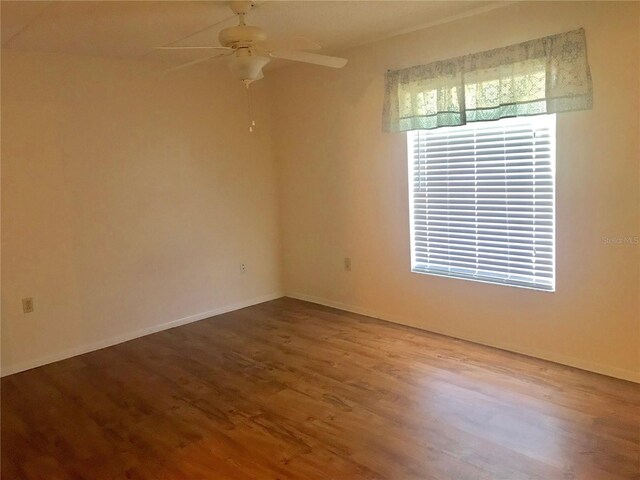 spare room with ceiling fan and hardwood / wood-style flooring